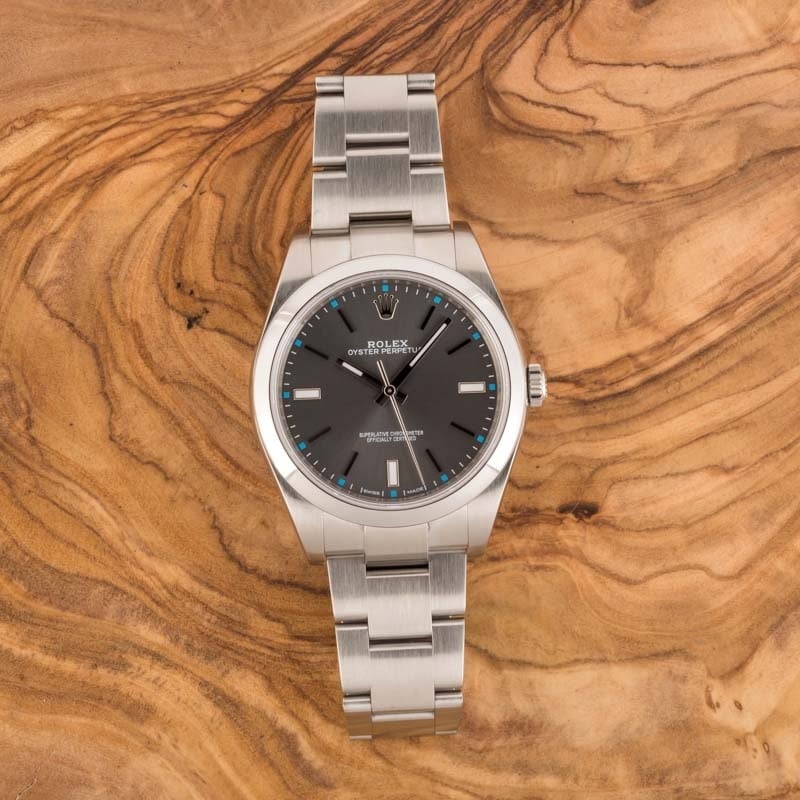 Rolex Oyster Perpetual 114300 Dark Rhodium Index Dial
